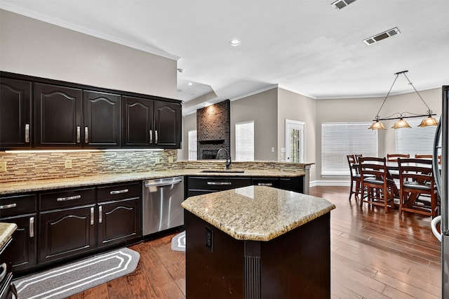 688 Lazy Acres Cir, Pottsboro, TX 75076 - kitchen with dishwasher, a sink, dark wood finished floors, decorative backsplash, and a kitchen island