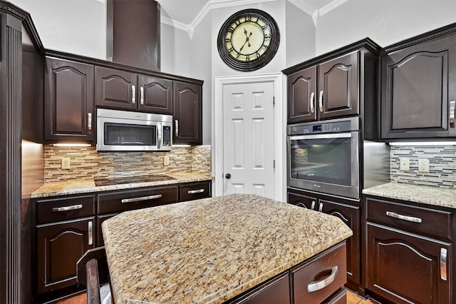 688 Lazy Acres Cir, Pottsboro, TX 75076 - kitchen featuring appliances with stainless steel finishes, ornamental molding, dark brown cabinets, light stone counters, and tasteful backsplash
