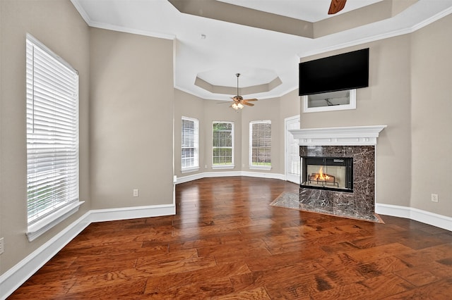 688 Lazy Acres Cir, Pottsboro, TX 75076 - unfurnished living room with a ceiling fan, a tray ceiling, and plenty of natural light