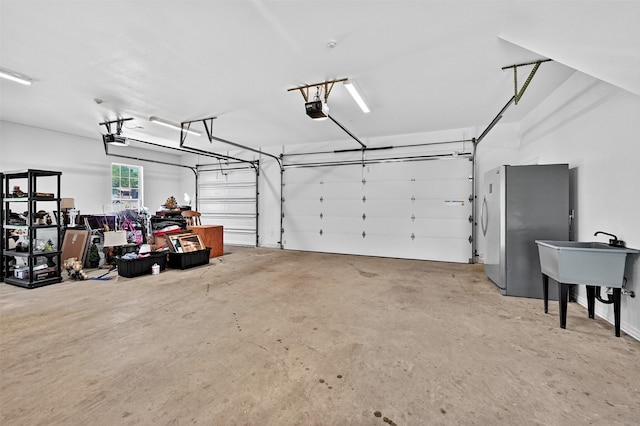 688 Lazy Acres Cir, Pottsboro, TX 75076 - garage with freestanding refrigerator and a garage door opener