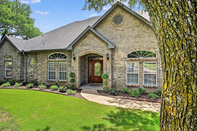 688 Lazy Acres Cir, Pottsboro, TX 75076 - view of front facade with brick siding, a front yard, and roof with shingles