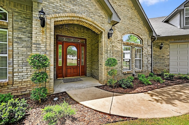 688 Lazy Acres Cir, Pottsboro, TX 75076 - entrance to property featuring brick siding, roof with shingles, and an attached garage