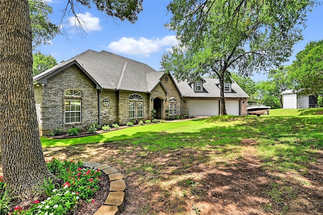 688 Lazy Acres Cir, Pottsboro, TX 75076 - view of front of house with brick siding, a front yard, a garage, and a shingled roof