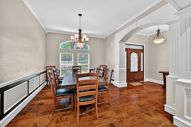 688 Lazy Acres Cir, Pottsboro, TX 75076 - dining area with arched walkways, crown molding, dark wood-style flooring, and a chandelier