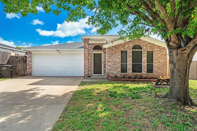 10228 Maverick Dr, Fort Worth, TX 76108 - ranch-style house featuring driveway, an attached garage, and brick siding