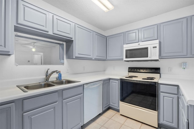 10228 Maverick Dr, Fort Worth, TX 76108 - kitchen with white appliances, gray cabinetry, light tile patterned floors, light countertops, and ceiling fan