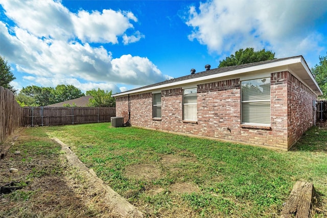 10228 Maverick Dr, Fort Worth, TX 76108 - back of house featuring a fenced backyard and brick siding