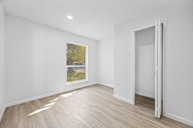 3841 Shady Hollow Ln, Dallas, TX 75233 - unfurnished room featuring light wood-type flooring, baseboards, and recessed lighting
