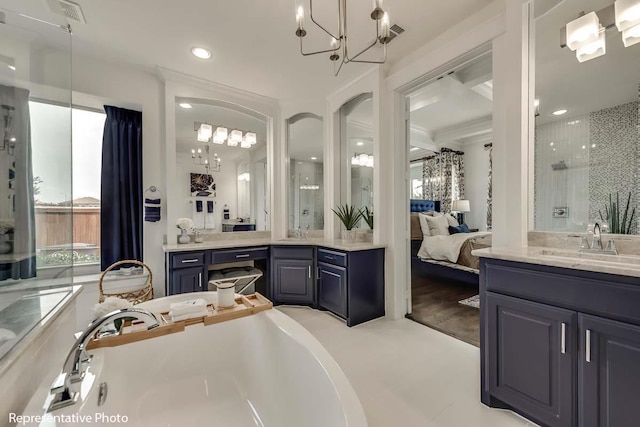 1706 Cedar Bluff Pkwy, Mansfield, TX 76063 - full bath featuring a chandelier, a shower stall, two vanities, a soaking tub, and recessed lighting