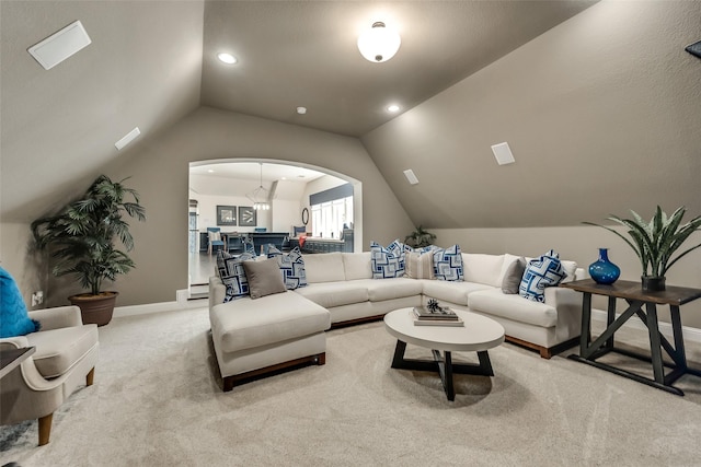 1706 Cedar Bluff Pkwy, Mansfield, TX 76063 - carpeted living room with arched walkways, lofted ceiling, baseboards, and recessed lighting