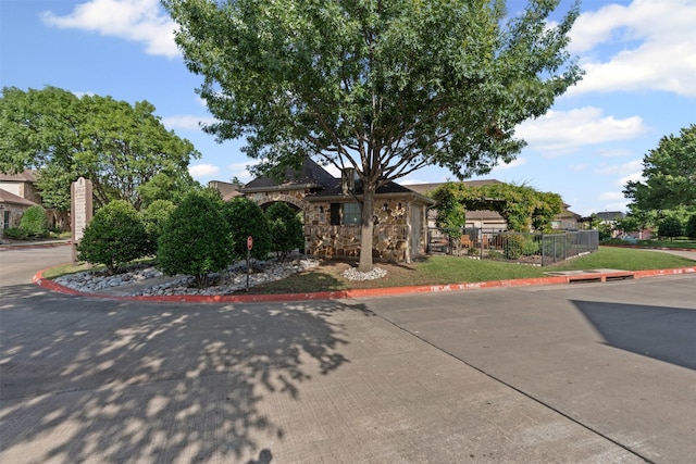 3075 Willow Grove Blvd Unit 2302, Mckinney, TX 75070 - view of property hidden behind natural elements featuring stone siding