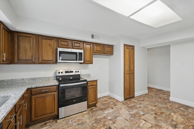 3217 Redwood St, Bedford, TX 76021 - empty room featuring baseboards and dark stone finish flooring