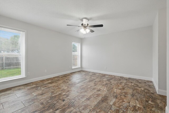 3217 Redwood St, Bedford, TX 76021 - empty room with ceiling fan and baseboards
