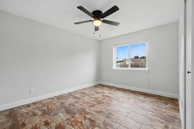 3217 Redwood St, Bedford, TX 76021 - empty room featuring baseboards and a ceiling fan