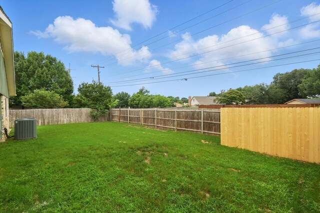 3217 Redwood St, Bedford, TX 76021 - back of house with board and batten siding, brick siding, and central AC