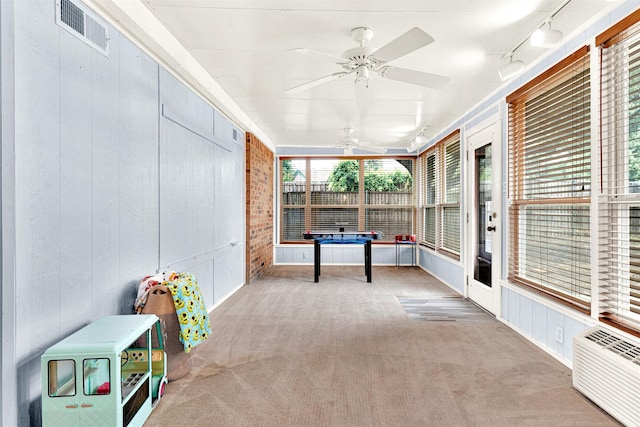 1305 Jabbet Dr, Plano, TX 75025 - unfurnished sunroom featuring a ceiling fan, track lighting, and a wall mounted AC