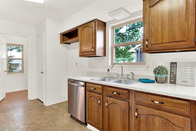 1305 Jabbet Dr, Plano, TX 75025 - kitchen featuring dishwasher, brown cabinetry, and light countertops