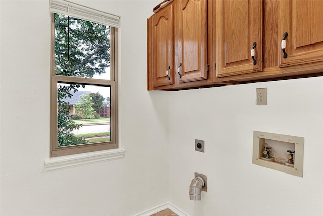 1305 Jabbet Dr, Plano, TX 75025 - laundry area with electric dryer hookup, cabinet space, and hookup for a washing machine