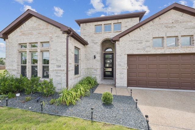 3205 Tradition Ct, Rowlett, TX 75088 - french country style house with brick siding and a garage