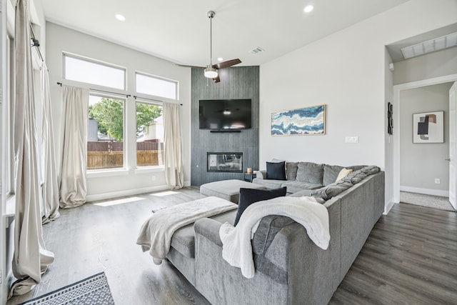 3205 Tradition Ct, Rowlett, TX 75088 - living room featuring baseboards, wood finished floors, recessed lighting, a fireplace, and ceiling fan