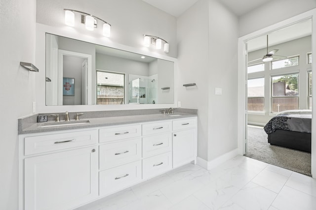 3205 Tradition Ct, Rowlett, TX 75088 - full bathroom featuring double vanity, a shower stall, marble finish floors, connected bathroom, and baseboards