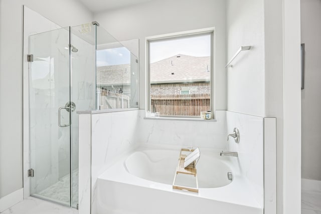 3205 Tradition Ct, Rowlett, TX 75088 - bathroom featuring marble finish flooring, a bath, and a marble finish shower