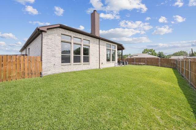 3205 Tradition Ct, Rowlett, TX 75088 - back of property featuring a chimney and brick siding