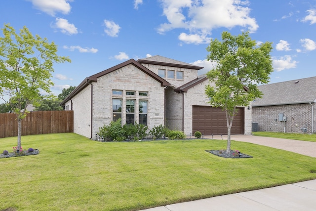 3205 Tradition Ct, Rowlett, TX 75088 - view of front facade with driveway, brick siding, and an attached garage