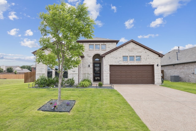 3205 Tradition Ct, Rowlett, TX 75088 - view of front of house featuring cooling unit, concrete driveway, an attached garage, and brick siding