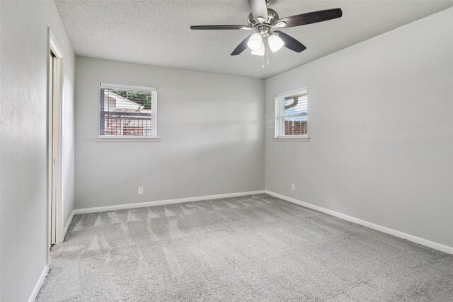 2201 Briarwood Blvd, Arlington, TX 76013 - carpeted empty room with ceiling fan and a textured ceiling
