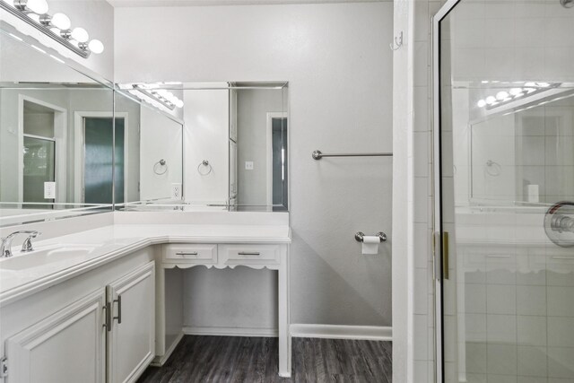 2201 Briarwood Blvd, Arlington, TX 76013 - full bath featuring vanity, a shower stall, and wood finished floors