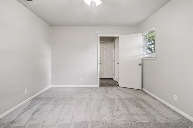2201 Briarwood Blvd, Arlington, TX 76013 - carpeted spare room featuring baseboards and ceiling fan