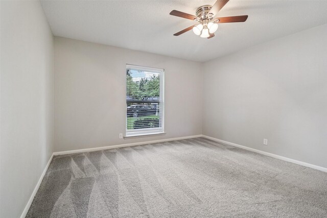 2201 Briarwood Blvd, Arlington, TX 76013 - carpeted empty room with a ceiling fan and baseboards