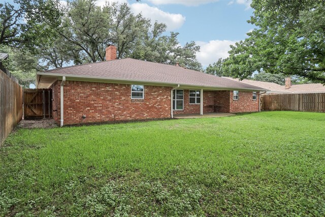 2201 Briarwood Blvd, Arlington, TX 76013 - fenced backyard featuring a patio