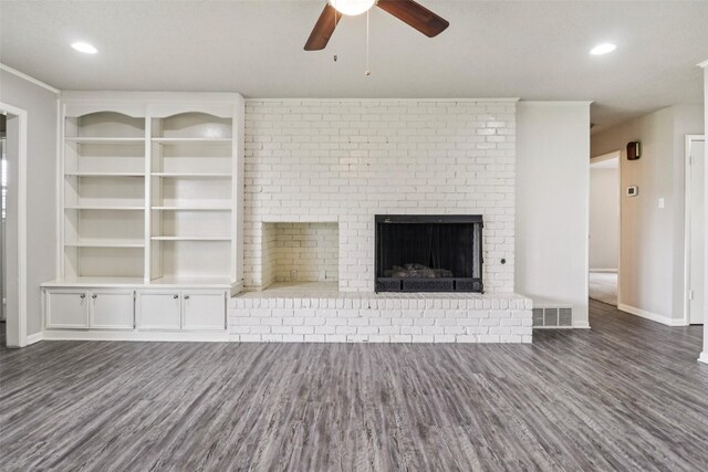 2201 Briarwood Blvd, Arlington, TX 76013 - unfurnished living room with wood finished floors, ceiling fan, a fireplace, and recessed lighting