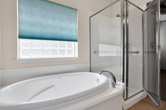 2111 Renaissance Dr, Denison, TX 75020 - full bath featuring a shower stall, a bath, and tile patterned floors