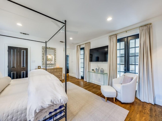 4604 Southern Ave, Highland Park, TX 75209 - bedroom featuring wood finished floors, ornamental molding, and recessed lighting