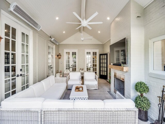 4604 Southern Ave, Highland Park, TX 75209 - living area with french doors, exterior fireplace, wood finished floors, a ceiling fan, and recessed lighting