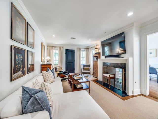 4604 Southern Ave, Highland Park, TX 75209 - living area featuring ornamental molding, a high end fireplace, wood finished floors, and recessed lighting