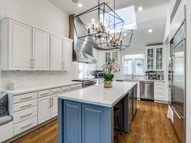 4604 Southern Ave, Highland Park, TX 75209 - kitchen with stainless steel appliances, a kitchen island, white cabinets, and recessed lighting