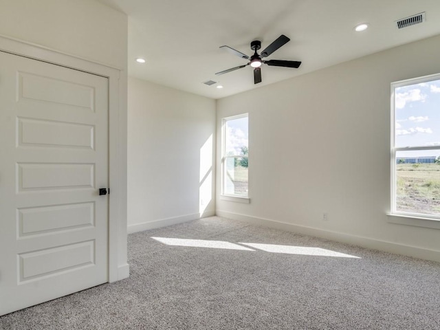 6434 Abner Rd, Terrell, TX 75161 - carpeted empty room featuring healthy amount of natural light, ceiling fan, baseboards, and recessed lighting