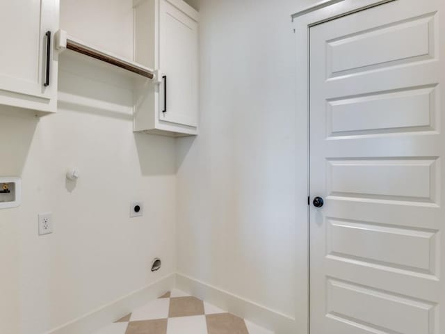 6434 Abner Rd, Terrell, TX 75161 - laundry room with electric dryer hookup, tile patterned floors, washer hookup, baseboards, and cabinet space