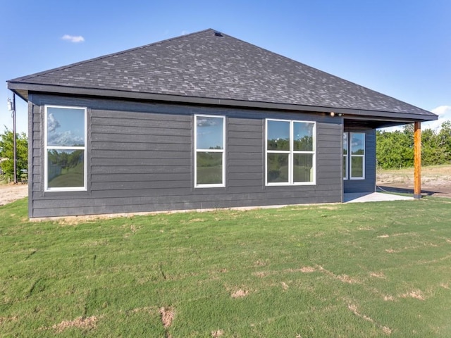 6434 Abner Rd, Terrell, TX 75161 - rear view of property with roof with shingles and a lawn
