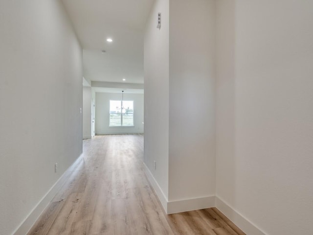 6434 Abner Rd, Terrell, TX 75161 - corridor featuring light wood-style floors, recessed lighting, baseboards, and a chandelier