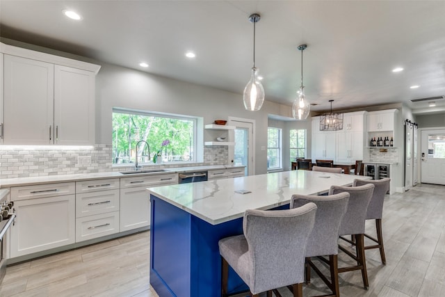 711 Majestic Oaks Dr, Oak Point, TX 75068 - kitchen with recessed lighting, stainless steel dishwasher, decorative backsplash, white cabinetry, and plenty of natural light