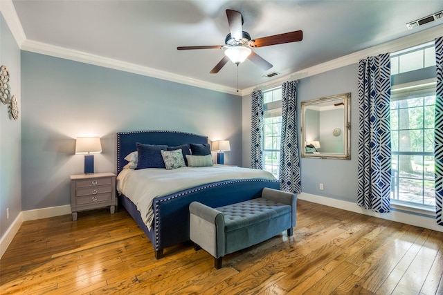 711 Majestic Oaks Dr, Oak Point, TX 75068 - bedroom featuring hardwood / wood-style flooring, multiple windows, crown molding, and ceiling fan