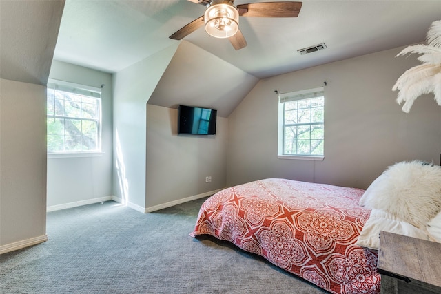 711 Majestic Oaks Dr, Oak Point, TX 75068 - carpeted bedroom featuring multiple windows, vaulted ceiling, and a ceiling fan