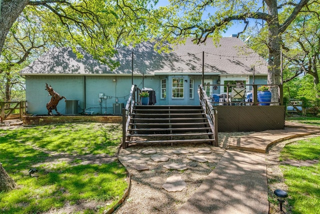 711 Majestic Oaks Dr, Oak Point, TX 75068 - view of front of house with stairs, a deck, a shingled roof, and a front yard