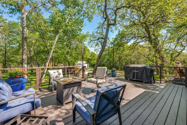 711 Majestic Oaks Dr, Oak Point, TX 75068 - wooden terrace with an outdoor living space with a fire pit and view of wooded area