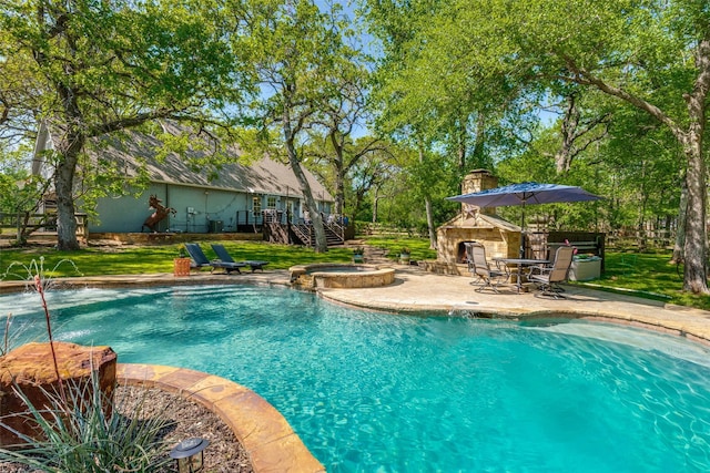 711 Majestic Oaks Dr, Oak Point, TX 75068 - view of swimming pool with a patio area, stairs, a pool with connected hot tub, an outbuilding, and a deck